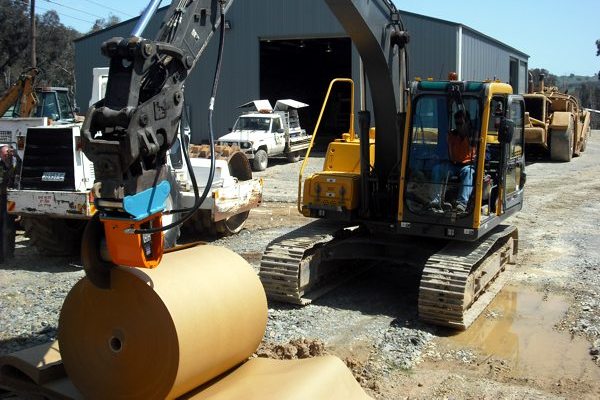 Cutting paper at a paper recycling depot using Echidna diamond rocksaw fitted with a woodcutting blade.